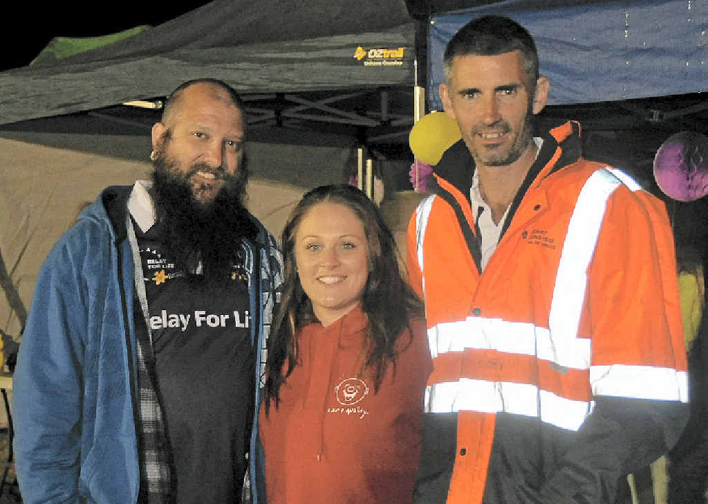 BEATING IT: Cancer survivors Brad Willard and Kelsey Burt with team mate Josh Clare walk during the Warwick Relay for Life held at the weekend. BEATING IT: Cancer survivors Brad Willard and Kelsey Burt with team mate Josh Clare walk during the Warwick Relay for Life held at the weekend.